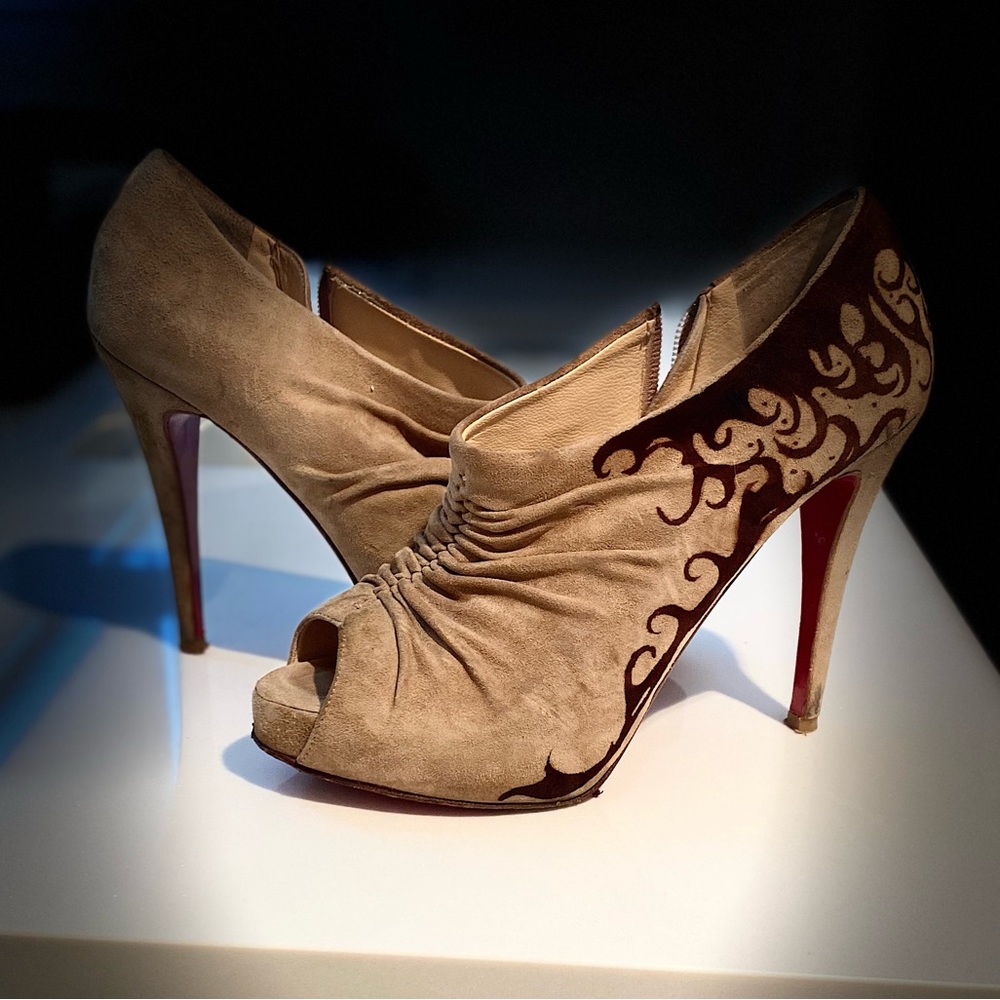 Louboutin Nude suede platform peeptoe booties. Rubber red soles and heel tips.